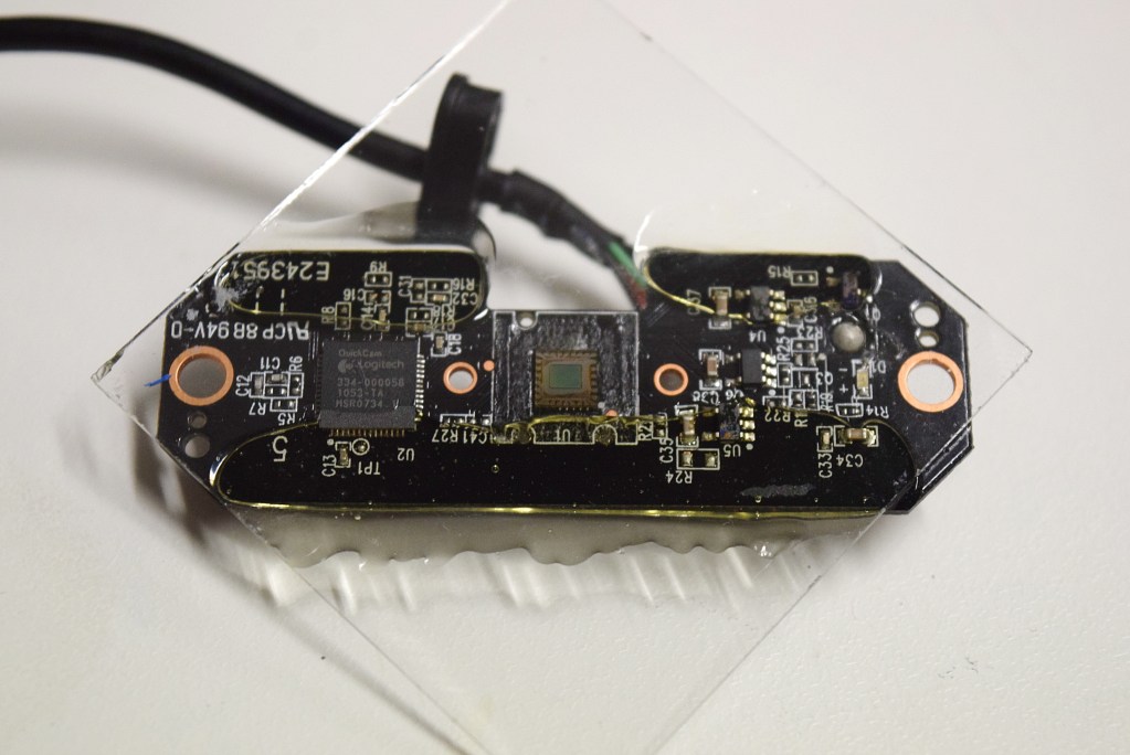 An exposed CMOS image sensor mounted on a camera circuit board
