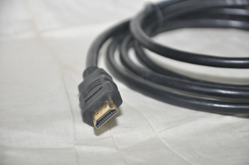 Photograph of a coiled HDMI cable with a standard HDMI Type A connector