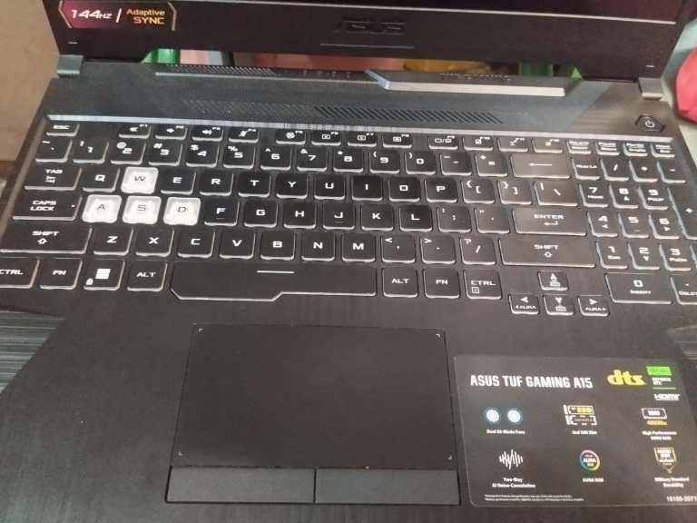 A laptop computer representing the device layer where operating systems coordinate local and cloud AI capabilities