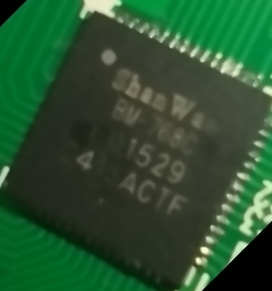 Close-up photograph of a microprocessor package mounted on a circuit board