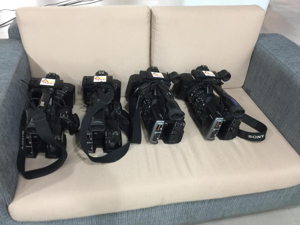 A digital video camera mounted on a tripod
