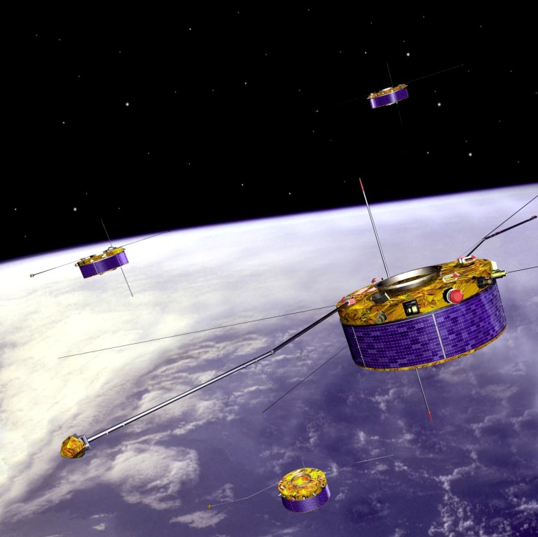 Artist view of ESA's four Cluster satellites flying in formation above Earth