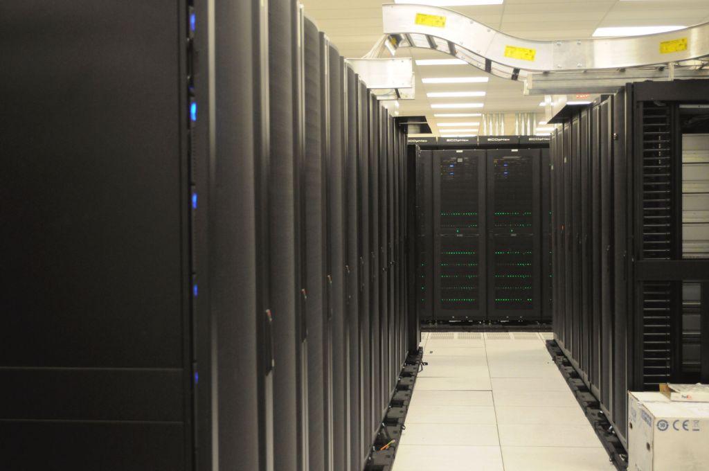 Rows of computer racks inside a data center