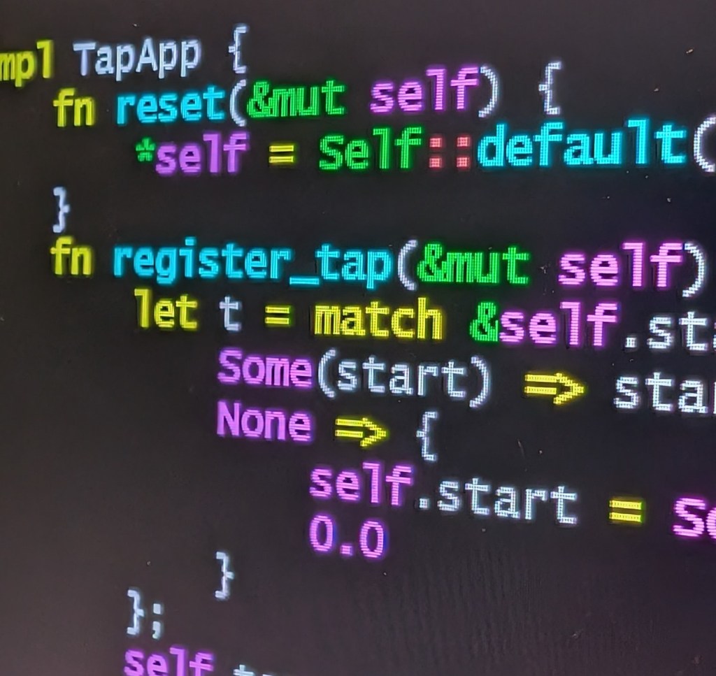 Rust source code displayed on a laptop screen