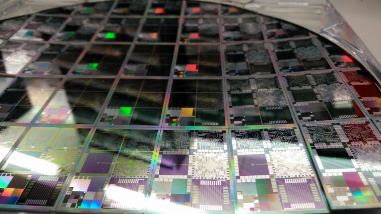A 12-inch semiconductor wafer containing microelectronic test structures