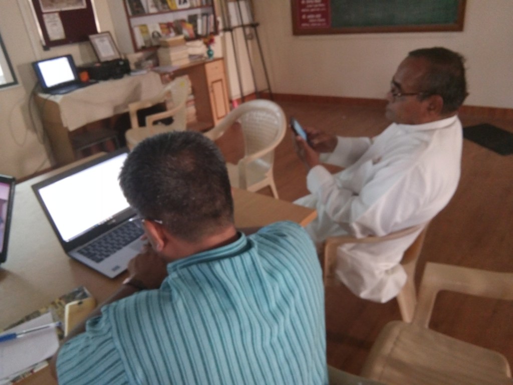 People working with a smartphone during a digital editing session